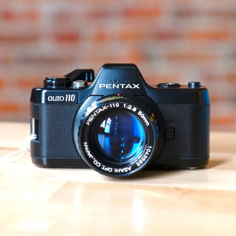 Pentax Auto 110 with 18mm, 24mm, and 50mm lenses.